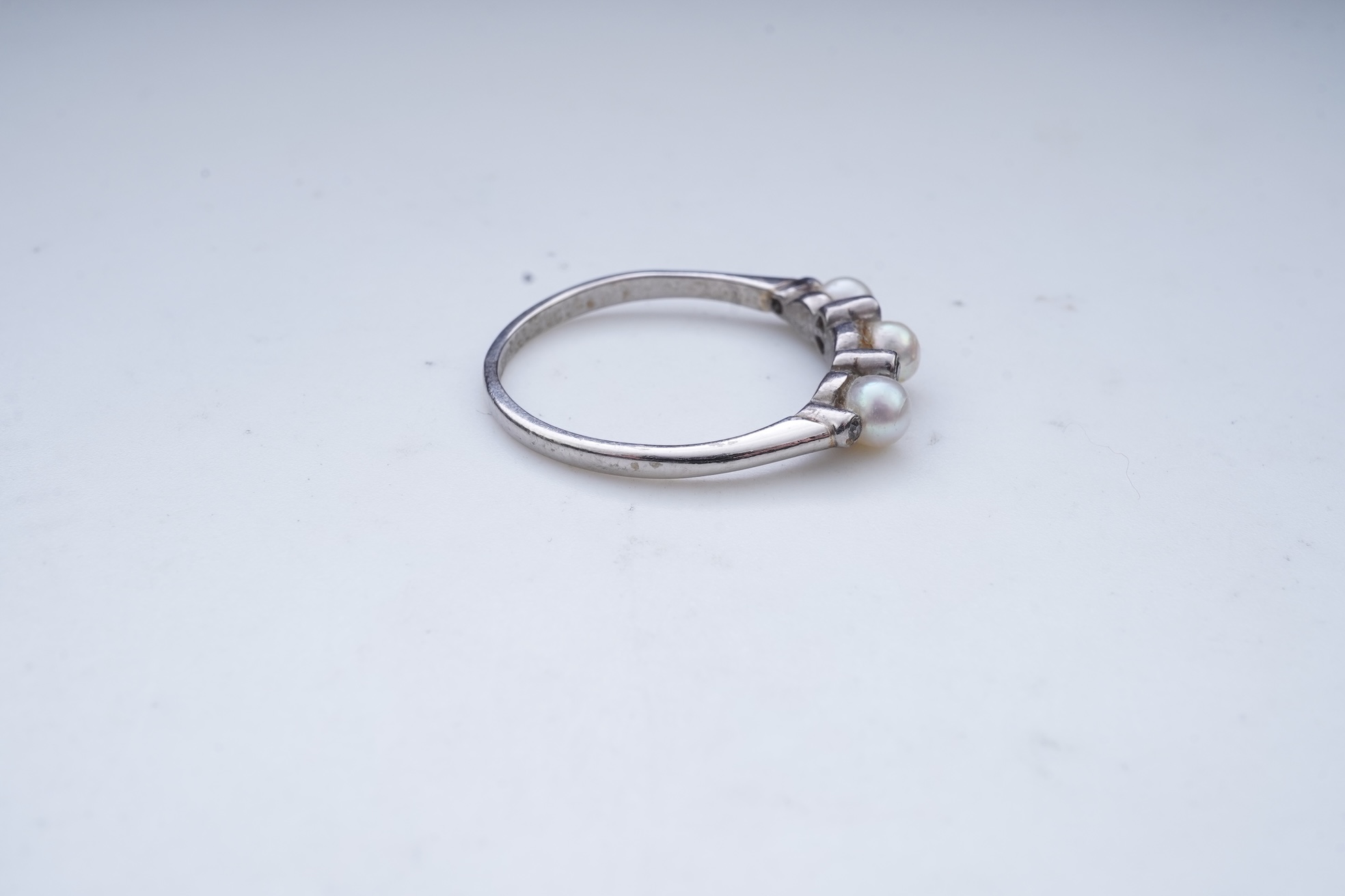 An Edwardian seed pearl brooch and a pearl and diamond ring